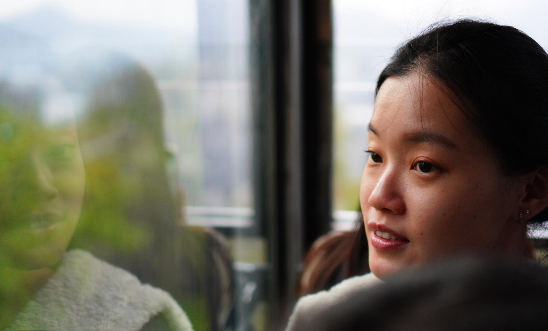 Portrait of Female model with Reflection in window